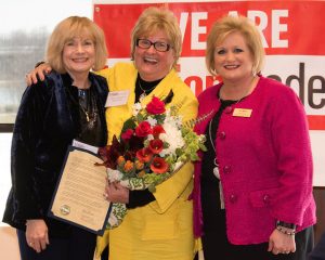 2018 ATHENA recipient Shary Williamson (center) receiving the ATHENA statue from program chair Diane Glassmeyer and WBC president Terri Martin.