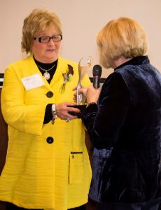 Shary Williamson (left) is presented the Athena award by event chair Diane Glassmeyer at the 2018 awards ceremony.
